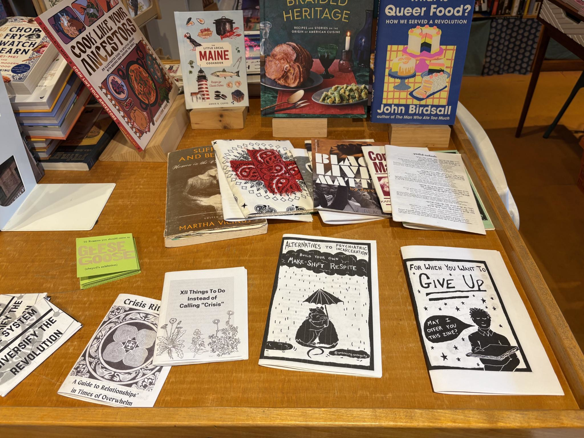 A table with some community-created zines (short for magazine) from the regular Midcoast Solidarity Zine Night events.